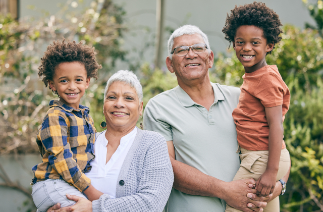 photo of grandparents holding grandchildren